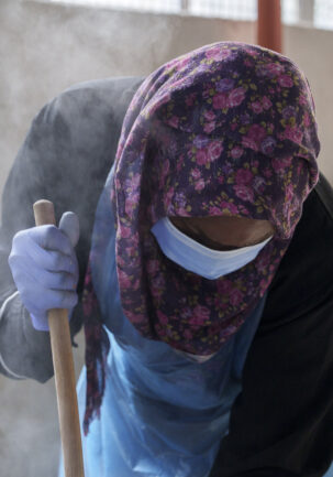 Migrant worker preparing food